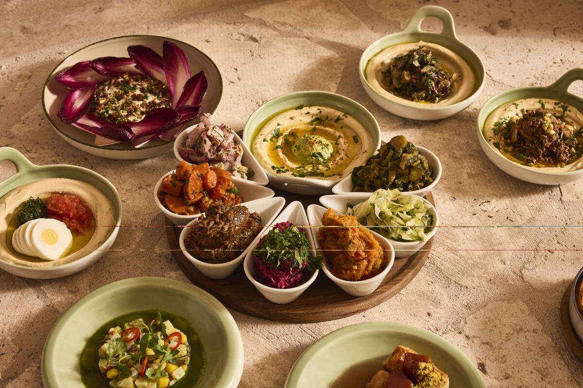 The salatim at Miami Beach’s Aviv is an optional add-on ($21 for the table) with seven ramekins with different spreads and mezzes.